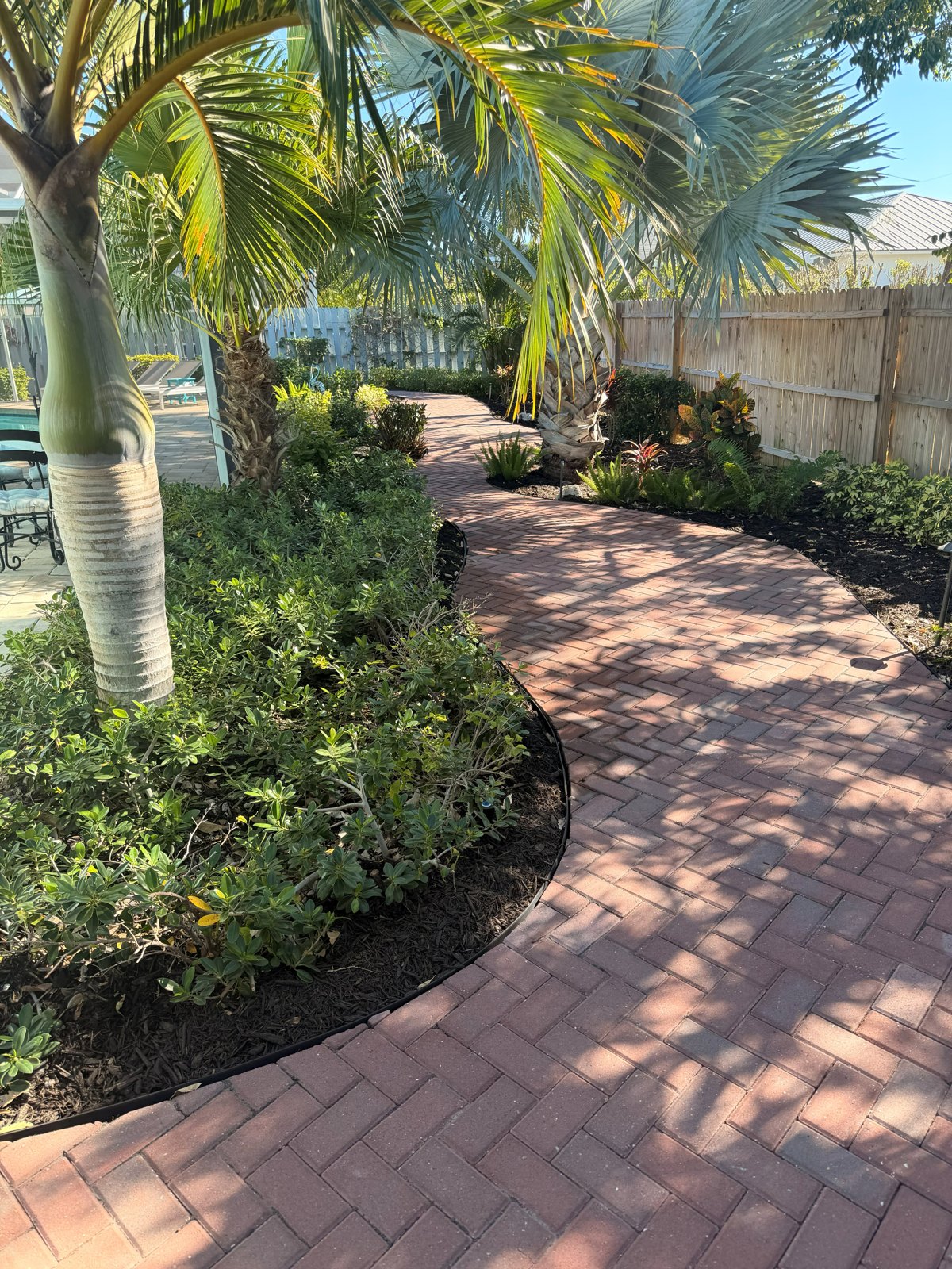 Tropical planting and paver paths